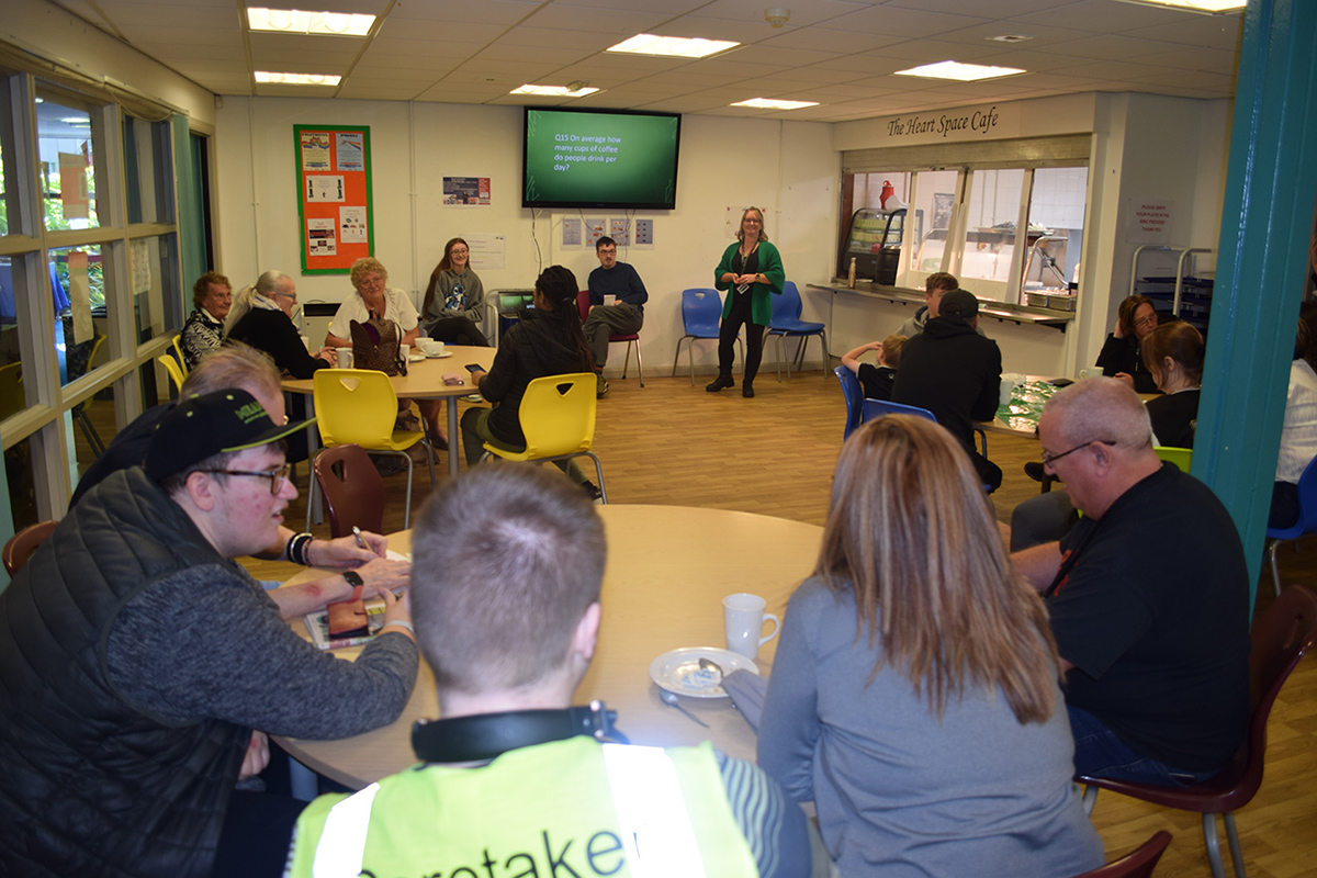 Learners and staff at an event in the cafe