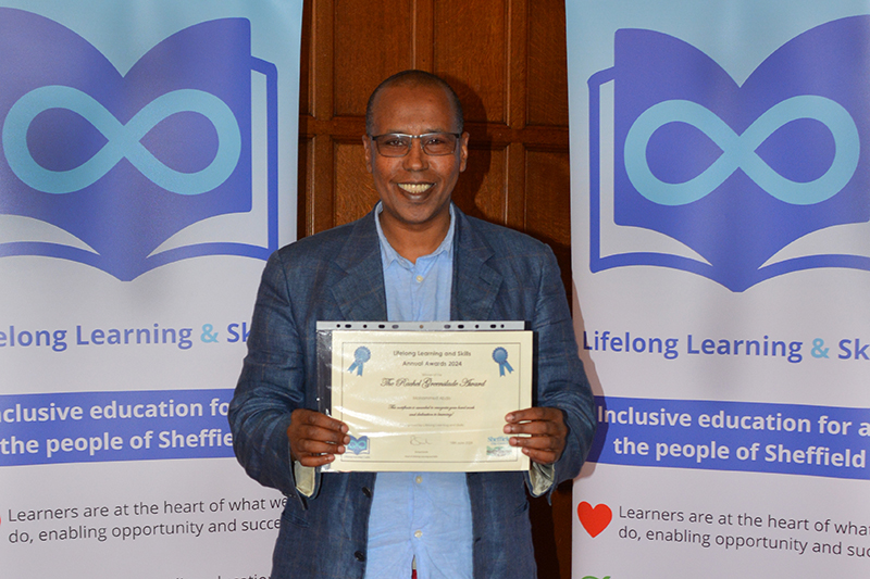 Learner holding a certificate