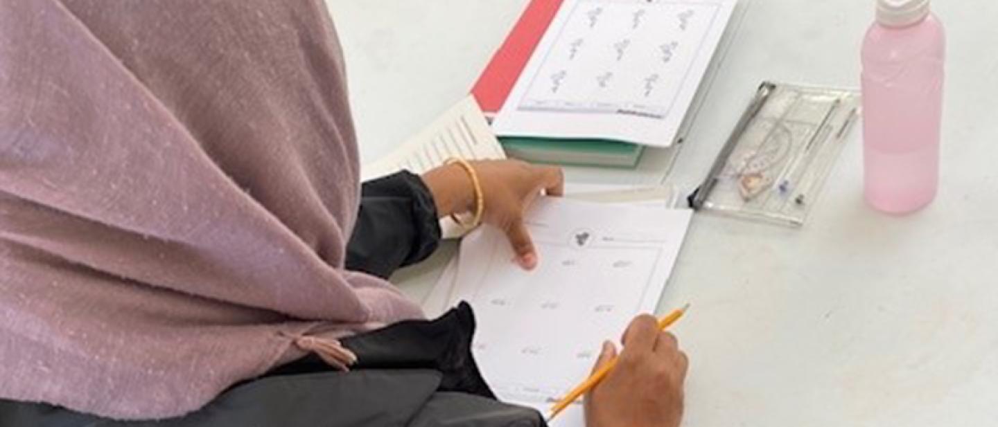 Lady completing a maths test